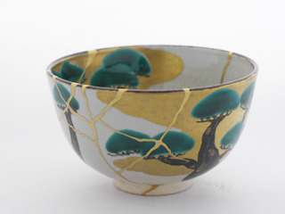 A teacup that was shattered into many pieces, and then resurrected using kintsugi