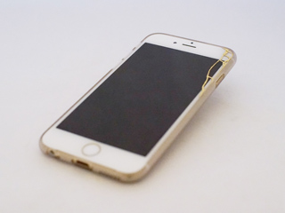 An iphone with a cracked screen that has been repaired using kintsugi