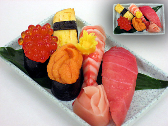 A plastic model of a plate of sushi