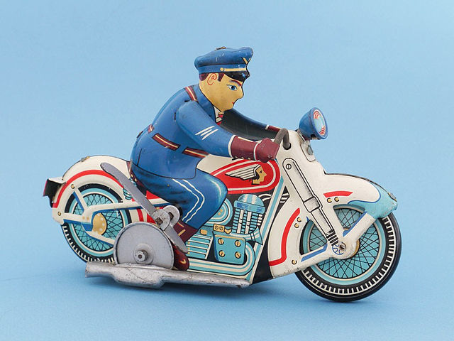 A Japanese tin toy policeman riding a motorbike