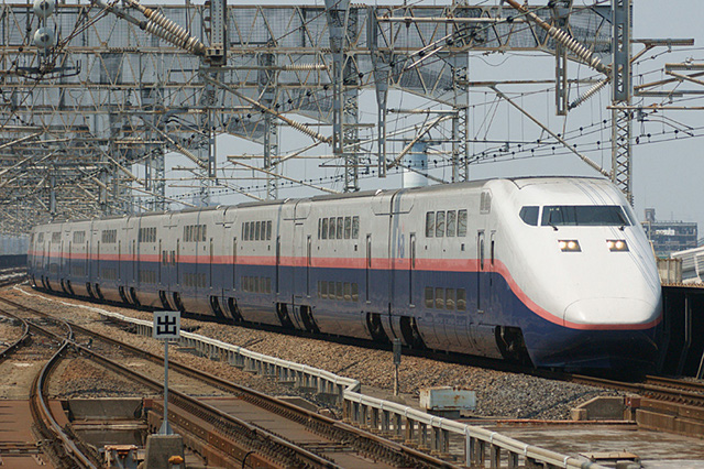 A double-decker Shinkansen approaching Omiya Station in Saitama Prefecture, Japan