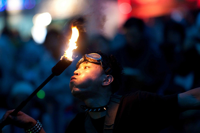 A man with a burning torch at the 2010 Fuji Rock Festival