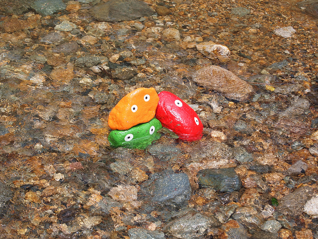 Rocks painted to look like monsters, in a stream at the Fuji Rock Festival