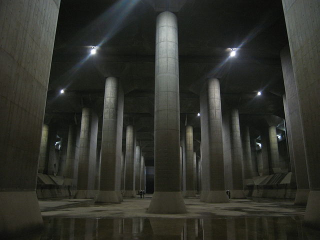 Tall concrete pillars in the storage tank of the G-Cans Project