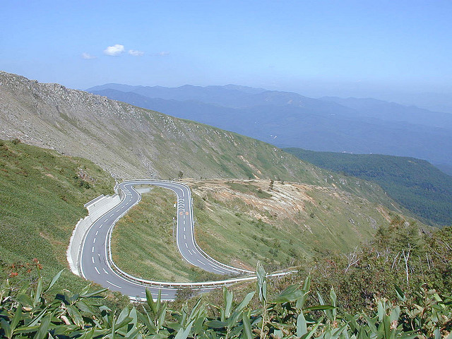 A switchback road up Kusatsu-shirane volcano